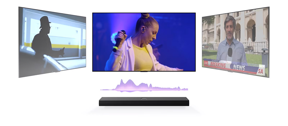 Το LG Soundbar έχει τρεις διαφορετικές οθόνες τηλεόρασης από πάνω. Η μία ακριβώς από πάνω δείχνει μια συναυλία όπου τραγουδά μια γυναίκα. Η τηλεόραση στα δεξιά δείχνει έναν εκφωνητή ειδήσεων στο γύρισμα ενός έκτακτου δελτίου ειδήσεων έξω από ένα στολισμένο κτίριο. Η τηλεόραση στα αριστερά δείχνει ένα στιγμιότυπο από μια ταινία δράσης με έναν άνδρα στη σκιά. Μεταξύ της τηλεόρασης και του soundbar, υπάρχει ένα μοβ διάγραμμα ενός ηχητικού κύματος.